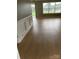 Living room with light wood laminate flooring at 1610 Flagler Ln, Charlotte, NC 28216