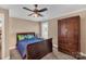 Bedroom with a sleigh bed, ceiling fan, and built-in wooden armoire at 312 Wintergreen Ct, Kings Mountain, NC 28086