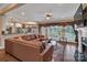 Spacious living room featuring a large leather sectional sofa and views to the kitchen at 312 Wintergreen Ct, Kings Mountain, NC 28086