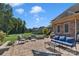 Large patio with fire pit, seating area, and a beautiful backyard view at 312 Wintergreen Ct, Kings Mountain, NC 28086
