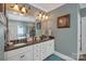 Elegant bathroom with double vanity, granite countertops, and a large mirror at 312 Wintergreen Ct, Kings Mountain, NC 28086