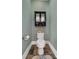 Small bathroom with toilet and wall-mounted cabinet at 312 Wintergreen Ct, Kings Mountain, NC 28086