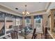 Bright dining room with a glass table and access to a deck or patio at 312 Wintergreen Ct, Kings Mountain, NC 28086