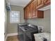 Laundry room with washer, dryer, and upper cabinets at 312 Wintergreen Ct, Kings Mountain, NC 28086