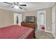 Bright bedroom with a large bed, ceiling fan, and access to a hallway bathroom at 312 Wintergreen Ct, Kings Mountain, NC 28086