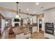Modern kitchen with a large island, granite countertops, and stainless steel appliances at 312 Wintergreen Ct, Kings Mountain, NC 28086