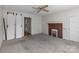 Living room with fireplace and built-in shelving at 600 Chapel S St, Landis, NC 28088