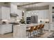 Modern kitchen with island, stainless steel appliances, and white cabinetry at 5229 Glenwalk Dr # 0062, Charlotte, NC 28269