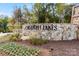 Stone entrance sign with landscaping and flowers for Griffith Lakes community at 5229 Glenwalk Dr # 0062, Charlotte, NC 28269