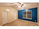 Bright bedroom with two closets and blue accent wall at 2692 Brackley Nw Pl, Concord, NC 28027