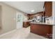 Eat-in kitchen with granite countertops and wood cabinets at 117 Bolding St, Gastonia, NC 28052