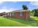 Another side view of the brick house with landscaping at 117 Bolding St, Gastonia, NC 28052