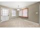 Bright dining area with tile flooring and neutral walls at 117 Bolding St, Gastonia, NC 28052