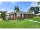 Front view of a charming brick ranch house with landscaping at 117 Bolding St, Gastonia, NC 28052