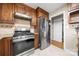 Kitchen features stainless steel appliances and wood cabinets at 117 Bolding St, Gastonia, NC 28052