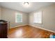 Well-lit bedroom with hardwood floors and large window at 117 Bolding St, Gastonia, NC 28052