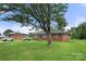Brick ranch home with a large yard and mature trees at 117 Bolding St, Gastonia, NC 28052