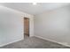 Bright bedroom with neutral walls, carpet flooring and a walk-in closet at 14950 Tamarack Dr, Charlotte, NC 28278