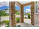 Stone pillars and a view of the neighborhood from the front porch at 14946 Tamarack Dr, Charlotte, NC 28278