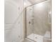 Modern shower with glass enclosure and built-in seat at 14946 Tamarack Dr, Charlotte, NC 28278