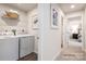 Convenient laundry room with washer, dryer and shelving at 165 Basildon St # 1011, Lancaster, SC 29720
