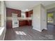 Renovated kitchen features modern appliances and dark wood cabinets at 333 Irwin St, Rock Hill, SC 29730