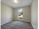 Bright bedroom with grey carpet and a large window at 333 Irwin St, Rock Hill, SC 29730