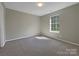 Bedroom with carpet flooring and a large window at 333 Irwin St, Rock Hill, SC 29730