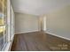 Bright and spacious living room with large windows and wood-look flooring at 333 Irwin St, Rock Hill, SC 29730