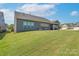 Spacious backyard with screened porch and lush green grass at 3087 Bartlett St, Fort Mill, SC 29715
