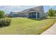 Landscaped backyard showcasing a screened porch and expansive lawn at 3087 Bartlett St, Fort Mill, SC 29715