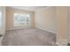 Well-lit bedroom with neutral walls and carpet flooring at 3087 Bartlett St, Fort Mill, SC 29715