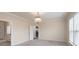 Spacious bedroom with neutral carpeting and a chandelier at 3087 Bartlett St, Fort Mill, SC 29715