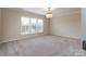 Bright bedroom with neutral carpeting and a chandelier at 3087 Bartlett St, Fort Mill, SC 29715
