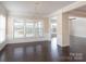 Spacious dining room with hardwood floors and a modern chandelier at 3087 Bartlett St, Fort Mill, SC 29715