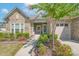 Inviting stone and shingle exterior, landscaped gardens, and a two-car garage at 3087 Bartlett St, Fort Mill, SC 29715