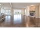 Open Gathering room with hardwood floors and stone fireplace at 3087 Bartlett St, Fort Mill, SC 29715