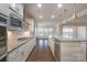 Modern kitchen features granite countertops, stainless steel appliances, and an island at 3087 Bartlett St, Fort Mill, SC 29715