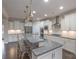 Modern kitchen with white cabinets and granite island at 3087 Bartlett St, Fort Mill, SC 29715