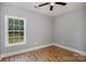 Simple bedroom featuring hardwood floors and a window at 397 Us Highway 52 N None, Wadesboro, NC 28170