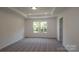 Spacious bedroom with carpeted floors and a large window at 3572 Nimbell Rd, Monroe, NC 28110