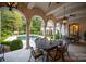 Outdoor dining area with seating for six under a covered patio at 423 Oakmont Ln, Waxhaw, NC 28173