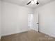 Spacious bedroom with an open door to another room and ceiling fan at 920 Holmes St, Salisbury, NC 28144