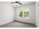 Well-lit bedroom featuring two large windows and a ceiling fan at 920 Holmes St, Salisbury, NC 28144