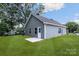 Gray house with a small patio and grassy backyard at 920 Holmes St, Salisbury, NC 28144