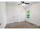 Bright bedroom with carpeted floor, window, and ceiling fan at 920 Holmes St, Salisbury, NC 28144