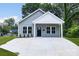 Gray house exterior with a white trim and a concrete driveway at 920 Holmes St, Salisbury, NC 28144