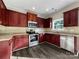 Kitchen with wood cabinets and stainless steel appliances at 3309 Paxton Ridge Dr, Indian Trail, NC 28079