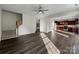 Spacious living room with hardwood floors, a staircase, and kitchen views at 3309 Paxton Ridge Dr, Indian Trail, NC 28079