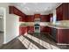 Galley kitchen with dark wood cabinets, granite countertops, and stainless steel appliances at 3309 Paxton Ridge Dr, Indian Trail, NC 28079